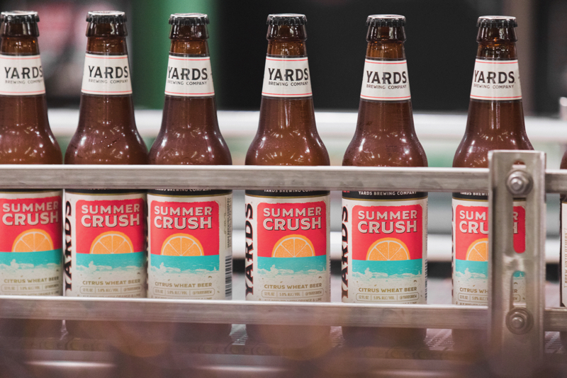 Yards Brewing Company Summer Crush bottles coming off the bottling line